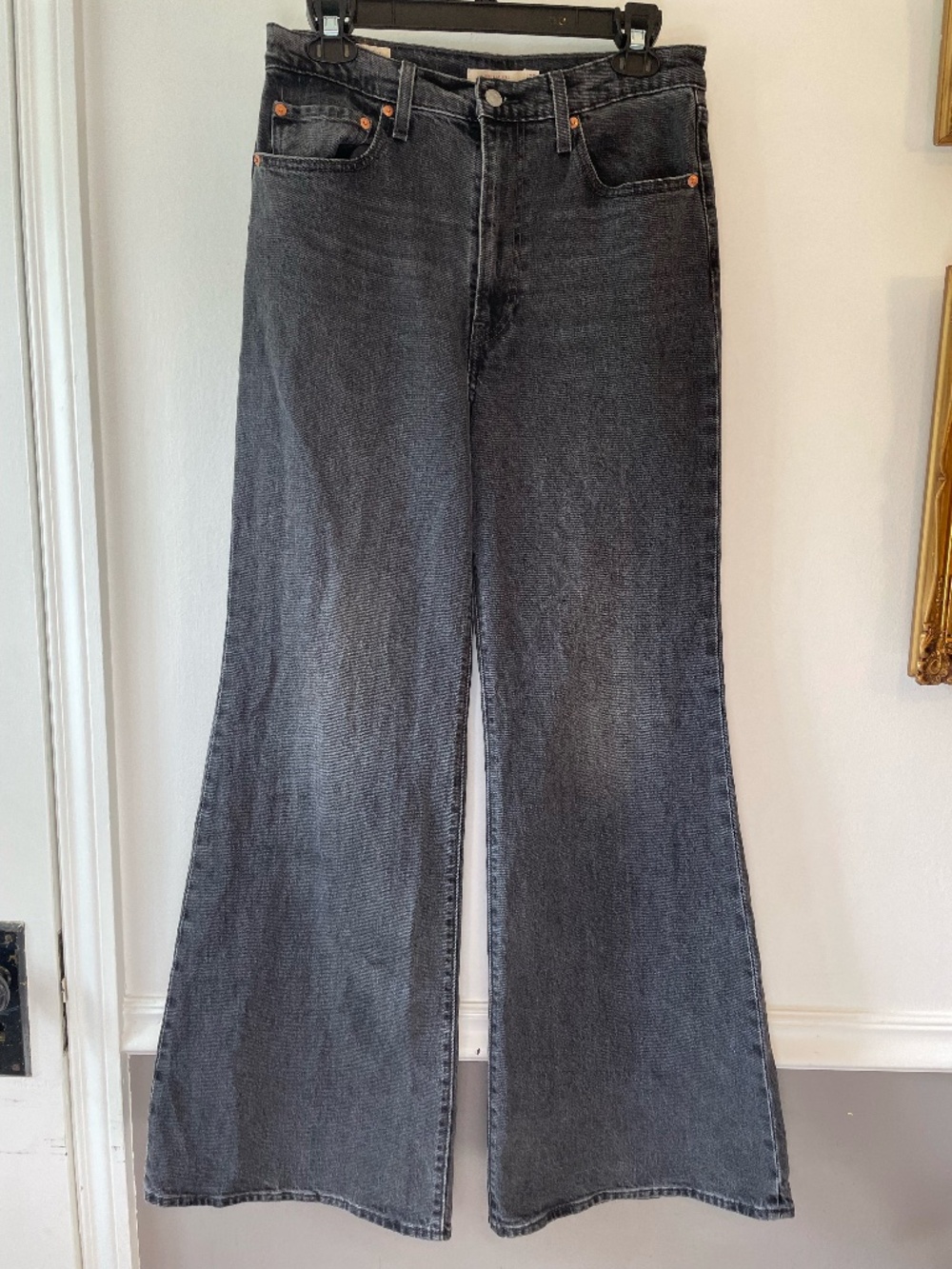Levi's Ribcage Bell 70s flare-leg ultra high rise jeans in washed black size 30